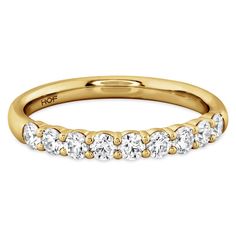 Nine strikingly stunning diamonds stand together to create this Hearts On Fire signature band.- 18K YELLOW GOLD.- DIAMOND WEIGHT: 0.47 CTW.- DIAMOND QUALITY: GH (NEAR COLORLESS) VS (VERY SLIGHTLY INCLUDED).- FINGER SIZE: 6.5.- Also available in Platinum, White or Rose Gold.- Can be ordered in most finger sizes.- Price may vary by finger size and metal fluctuations.- **One Year Manufacturer's Warranty**. Gold Eternity Band With Lab Grown Diamonds, Dazzling Gold Eternity Band With Brilliant Cut, Dazzling Gold Half Eternity Wedding Ring, Gold Lab-grown Diamond Eternity Band For Anniversary, Gold Diamond Round Cut Eternity Band, Dazzling Gold Eternity Band For Anniversary, Dazzling Gold Eternity Band With Prong Setting, Gold Diamond Eternity Band With Round Cut, Gold Lab Grown Diamond Eternity Band