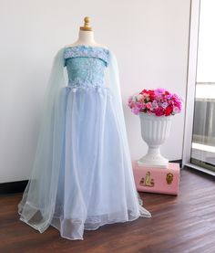 This sky blue dress is a dream.  Its perfect for any special occasion a girls dress to wear to a wedding.  This blue ball gown is perfect for walking the runway at a girls pageant dress. Wherever you little princess is going to, she will be the bell of the ball! Only 1 available size 6 to small 8 This dress if made with blue bridal lace and lined with blue lycra.  The cape is made with brooch pins and is removable! So you get 2 dressing in 1! READY TO SHIP NOW. If you have any other questions please feel free to contact me.  Also you can follow me on all social platforms @Pinkerflies Princess Dress With Lace Bodice And Tulle For Dress-up, Blue Princess Dress With Fitted Bodice, Organza Pageant Dress For Debutante Ball During Prom Season, Blue Tulle Ball Gown For Prom, Blue Princess Dress With Fitted Bodice For Wedding, Light Blue Princess Dress With Fitted Bodice, Princess Dress With Tulle Skirt And Fitted Bodice, Light Blue Princess Style Dress With Fitted Bodice, Blue Tulle Skirt Dress For Debutante Ball