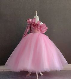 Make your little princess's dreams come true with our Pink One Shoulder Princess Ball Gown! This custom-designed dress is perfect for Barbie-themed parties or any special occasion where she wants to shine like royalty. The puffy design adds volume and flair, ensuring she'll feel like the belle of the ball. Crafted with attention to detail and made from high-quality materials, this dress is not only stylish but also comfortable for all-day wear. Whether it's her birthday or another special event, she'll love twirling and dancing in this enchanting princess dress. Order now and let her imagination soar! Pink One Shoulder Princess Ball Gown- Custom Design Puffy Dress for Barbie Parties- Princess Dress for Girls Birthdays and Special Occasions Kids Ball Gowns Princesses, Barbie Frocks For Kids, Kids Gown Princesses, Kids Birthday Dress For Girl, Barbie Parties, Barbie Princess Dress, Princess Dresses Kids Ball Gowns, Ball Gowns For Kids, Kids Birthday Dresses