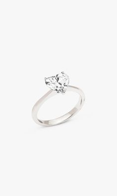 Open your heart to this timeless 14K white gold, 1.59 carat diamond ring. Adorning 14K white gold is a gorgeous sustainable, lab-grown, heart cut diamond, nestled in a 3-prong setting. Featuring an E/F color and VS clarity, this stackable piece shines at every angle. Part of our "Love Yourself" series, this statement ring is perfect for self-gifting, exuding the love you show for yourself and others. *Note: 7 day return for store credit only. No exchanges allowed. Product Details 1.59 Carat Hear Moissanite Heart Cut Diamond Ring For Proposal, Heart Cut Moissanite Diamond Ring For Proposal, Heart Shaped Moissanite Diamond Ring With Brilliant Cut, Heart-shaped Moissanite Wedding Ring In White Gold, White Heart Cut Brilliant Ring, Heart Cut Moissanite Wedding Rings, White Heart Cut Lab Grown Diamond Ring, Heart Cut Lab Grown Diamond Ring, Fine Jewelry Heart Cut Lab Grown Diamond Ring