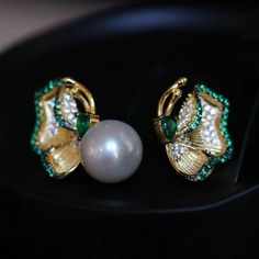 💚💚 Specifics: Materials: Natural freshwater Pearl With 925 Silver And Zircon Earrings Size: 12mm*22mm Pearl Diameter: 10mm*10mm Closure: the closure is made of 925 sterling silver.  Handmade Artwork, original design and copyright protected  Metal: Gold plated s925 silver 💚💚Shipping We ship it in 5-7 days after the payment is made and you may choose your personalized shipping services. We shipping world wide and it is free international shipping. Please kindly be reminded that we are not resp Green Pearl Earrings For Gift, Green Pearl Earrings As Gift, Fine Jewelry Green Pearl Earrings For Gift, Green Pearl Earrings For Anniversary, Green Pearl Earrings For Wedding, Pearl Clip-on Earrings As Gift, Elegant Green Pearl Earrings For Pierced Ears, Elegant Green Pearl Earrings Gift, Pearl Studs Earrings