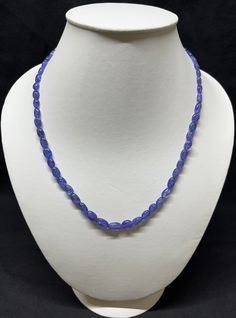 "This tanzanite necklace is a wonderful piece of Jewelry that will have everyone complimenting you. This tanzanite necklace goes with everything. This versatile blue rarest  premium AAA quality tanzanite necklace makes us look more put together in a matter of minutes while adding just the right amount of glitter to attract people's attention. Simple, elegant and Ideal for December birthdays! Product Details : Item Code : JE-N-10 Gemstone Name : Natural Premium Blue Tanzanite Smooth Rondelle Necklace Chain Style : Beaded Beads Shape : Smooth Rondelle Beads Beads Size : 5MM+ Length : 16\" Inch Approx. + Lobster Clasp with +2 inch Extender Product Weight : 20 Grams Approx. Sterling Silver Weight : 2 Grams. Approx. Happy Shopping!" Blue Oval Necklace With Faceted Beads, Oval Blue Necklaces With Faceted Beads, Blue Oval Necklaces With Faceted Beads, Blue Tanzanite Oval Necklaces, Blue Oval Tanzanite Necklace, Oval Tanzanite Blue Necklace, Blue Tanzanite Gemstone Beads Necklace, Look More Put Together, Rondelle Necklace