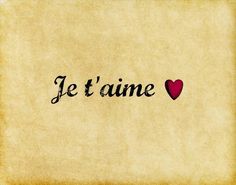 the word je t'aime written in black ink with a red heart on it