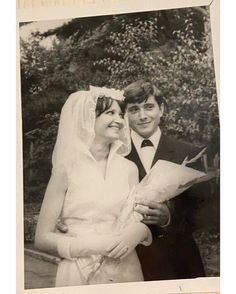 an old black and white photo of a bride and groom