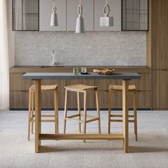 two stools and a table in a room