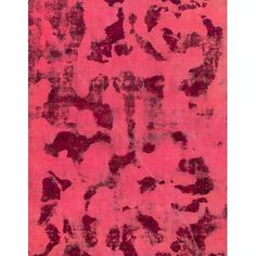 a pink rug with black and red designs on it