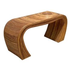 a wooden bench made out of wood with curved legs and curves on the top,