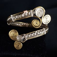 This unique Viking- inspires bangle is handwoven from lengths of alpaca silver and brass wire.  It is strong and springy, allowing it to open to slide your wrist in (see photos/video).  The circumference is 210mm, but the bracelet's total length is 263mm, so this style is adjustable because of this.   It is made from brass and alpaca, or nickel, silver, and is darker than sterling silver. Filigree Bangle, Diy Crafts Jewelry, Nickel Silver, Sterling Silber, Jewelry Crafts, Alpaca, Bangle Bracelets, Jewelry Bracelets, Hand Weaving