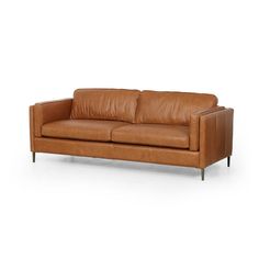 Clean, mid-century styling plus rich butterscotch top-grain leather equals our Livie Sofa. With her tailored lines and slim legs of antique brass she adds laid back luxe vibes to your space.Overall Dimensions: 84.00"w x 36.00"d x 31.50"hColor: rich butterscotchMaterials: Top grain leather.FREE SHIPPINGPLEASE NOTE THIS IS FROM OUR DESIGNER LUXE COLLECTION. PLEASE ALLOW 4-6 WEEKS FOR DELIVERY Brass Legs, Plush Sofa, Lulu And Georgia, Leather Couch, Brown Sofa, Burke Decor, Mid Century Style, Top Grain Leather, Room Sofa