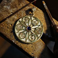 Symbolic Jewelry With Large Oval Pendant, Symbolic Large Oval Pendant Jewelry, Spiritual Compass Pendant Jewelry, Symbolic Jewelry With Large Medallion Pendant, Symbolic Hand Forged Necklaces, Symbolic Round Necklace With Intricate Design, Symbolic Round Hand Forged Jewelry, Symbolic Round Large Pendant Jewelry, Bronze Byzantine Round Jewelry