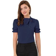 This regular-fit blouse will complement many body types to keep you looking great all day. The soft woven poly shapes a gathered neck, straight-cut silhouette, framed by puffy short sleeves with elastic cuff. Your wardrobe is not complete without this elegant office shirt. Pair it with high-waist pants and heels for an easy chic style. A sweet bow tie detail lends an elegant air to an everyday top. Blue Fitted Tie Neck Blouse, Blue Fitted Blouse With Tie Neck, Blue Padded Blouse For Work, Fitted Tie Neck Top For Workwear, Blue Puff Sleeve Shirt For Work, Solid Color Office Lady Tops, Blue Fitted Tie Neck Tops, Fitted Tie Neck Blouse For Work, Solid Tie Neck Blouse For Office