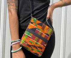 "This beautiful Kente Mini-Crossbody Bag is perfect for all your outings. It features: -42\" leather strap. Dimensions  7\"x 8\"" Multicolor Crossbody Shoulder Bag For On-the-go, Casual Crossbody Box Bag For On-the-go, Casual Crossbody Box Bag With Phone Pocket, Casual Crossbody Box Bag With Mobile Phone Pocket, Casual Crossbody Box Bag With Mobile Phone Holder, Fall Square Shoulder Bag With Mobile Phone Pocket, Casual Square Box Bag With Adjustable Strap, Casual Square Phone Bag With Adjustable Strap, Casual Phone Bag With Detachable Strap