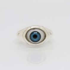 Sterling Silver Evil Eye Blue Dome Ring ...Marked 925...Total of weights 3.9grams...Size 6...Measure of Face 11.3MM...It's in very good condition. Classic Blue Turquoise Ring In Sterling Silver, Classic Blue Turquoise Sterling Silver Ring, Blue Signet Ring With Polished Finish For Promise, Blue Rings With Polished Finish, Blue Sterling Silver Rings With Polished Finish, Blue Sterling Silver Ring With Polished Finish, Blue Classic Sterling Silver Signet Ring, Classic Blue Sterling Silver Signet Ring, Classic Handmade Blue Rings