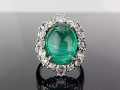 A gorgeous Zambian Emerald stone weighing 9.98 carats of an ideal color and great luster, completely transparent with very few naturally occurring inclusions. The Emerald and Diamonds all set in solid 18K White Gold. Free shipping provided. Currently size US 6, free resizing service available. Emerald Oval : 9.98 Cts White Gold : 11.06  Grams Three Stone Ring Settings, Emerald Cabochon, Zambian Emerald, Emerald Stone, Paper Clay, Three Stone Rings, Natural Emerald, Three Stone, Houston Tx