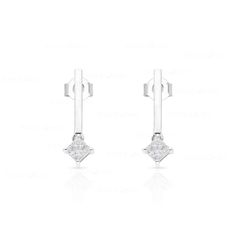 These sleek, modern bar earrings feature two princess-cut diamonds set in lustrous 10k gold. Perfect for the fashion-conscious, contemporary woman, they will be an eye-catching addition to any outfit. Modern Linear Earrings With Diamond Accents For Formal Events, Modern Linear Earrings With Diamond Accents For Formal Occasions, Modern Linear Earrings For Anniversary, Modern White Gold Earrings With Tension Setting, Modern Diamond Earrings With Tension Setting, Modern Single Diamond Earrings For Formal Occasions, Modern Formal Earrings With Single Diamond, Modern Diamond Linear Earrings As Gift, Modern Diamond Linear Earrings