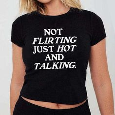 Not Flirting Just Hot And Talking Baby Tee, Women's Fitted Tee, Y2K Shirt, Trendy Top, Y2K Baby Tee, 90s Style Tee DETAILS - 100% cotton (fiber content may vary for different colors) - tear-away label  SIZING Please find the size chart in the listing photo before purchasing. PLEASE NOTE: Our Baby tee is sized for a youth, reminiscent of the '90s-era shrunken-down T-shirt. This style, popularized by the skater/raver culture of the time, is not to be confused with the modern crop top. The baby tee Weird Shirts Graphic Tees, Y2k Slogan Tee, Funny T Shirts For Women, Trendy Tshirt Designs, Graphic Design Tshirt, Diy Goth Clothes, Iconic Shirts, Y2k Slogan, Tumblr T Shirt