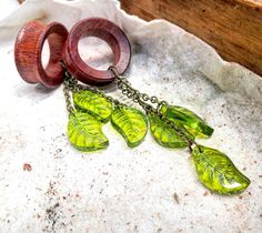 "1 PAIR of handmade Organic Glass Tree Leaf Dangles AVAILABLE AS- Plug Gauges (Solid no hole) or Tunnels (Hole in the middle) SIZE OPTIONS: 2G (6mm) 1G (7mm) OG (8mm) 3/8\" (9mm) 00G (10mm) 7/16\" (11mm) 1/2\" (12mm) 1/2\" (13mm) 9/16\" (14mm) 19/32\" (15mm) 5/8\" (16mm) 43/64\" (17mm) 11/16' (17.5mm) 3/4\" (19mm) 13\"/16\" (20mm) 7/8\" (22mm) 15/16\" (24mm) 1\" (25.5mm) 1 & 1/8\" (28mm) 1 & 5/32\" (29mm) 1 & 1/4\" (32mm) 1 & 3/8\" (35mm) 1& 7/16\" (36mm) 1 & 1/2\" (38mm) Wedding Gauges, Glass Ear Plugs, Bird Cottage, Dangle Gauges, Wood Resin Necklace, Dangle Plugs, Wooden Plugs, Ear Accessories, Organic Glass