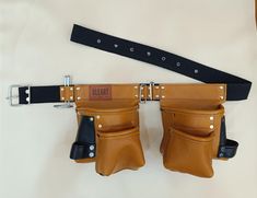 a pair of leather gloves hanging on a belt