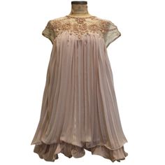 Apricot-Colored, Flouncy Party Dress With Short Sleeves And A Top Layer Of Pleated Chiffon.