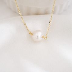 This shiny dainty pearl necklace is definitely durable for everyday wear. It is perfect on its own and also looks great for layering with other necklaces in your collection. Pearl is the birthstone for June. All items are handmade by me in my home studio. ★ D E T A I L Made from high-quality materials~ Waterproof, hypoallergenic, wear 24/7. * 925 sterling silver * 14K gold filled * Freshwater Pearl - With a 2" extender chain * W H A T  I S  14 K  G O L D - F I L L E D * Gold-filled jewelry legal Dainty Pearl Pendant Charm Necklace For Everyday, Dainty Pearl Pendant Charm Necklace, Everyday Pearl Necklace With Pendant, Delicate Everyday Pearl Necklace, Delicate Round Pearl Necklace For Everyday, Minimalist Pearl Pendant Charm Necklace For Everyday, Dainty Everyday Necklace With Pearl Charm, Minimalist Pearl Charm Necklace For Anniversary, Minimalist Pearl Charm Necklace With Delicate Chain