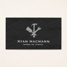 a black and white business card with an image of a hammer, wrench and spanner on it