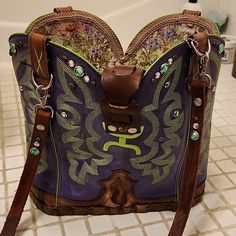 Cowgirl Boots Made Into A Purse. Original Tag Attached "Miss Daisy" #893. Made In The Usa. Sonoita, Az. Purple Genuine Leather With Lime Green Embroidery. Finished Treated Wood On Bottom Of Purse With Sc Brand. Bohemian Green Embellished Bag, Purple Leather Bucket Bag, Bohemian Green Bag With Fringe, Turquoise Hand Tooled Bag, Coach Purple Bags For On-the-go, Western Purses And Handbags Cowgirl, Western Nails, Green Embroidery, Purple And Green