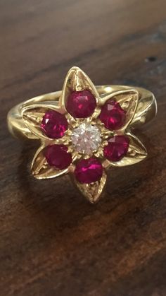 Estate 14k Gold Execellent Ruby Diamond Ring Even Prettier Than it looks in Pic Gross Weight- 7.5 gm Gold - 14K 6.8 gm approx Ruby - Excellent Quality .50 carat Diamond- Round Solitaire .20 carat approx Size: 7.5 / 8 Top measures .62 inch Item# DB 6/15/15 #11 Please call 714-924-2732 for any questions Classic 14k Gold Flower Ring With Gemstone, Yellow Gold Flower Ring With 17 Jewels For Anniversary, Formal Yellow Gold Flower Ring With Center Stone, Yellow Gold Ruby Flower Ring For Anniversary, Turquoise Diamond Earrings, Yellow Diamond Earring, Convertible Earrings, Kyanite Earrings, Sapphire Diamond Pendant