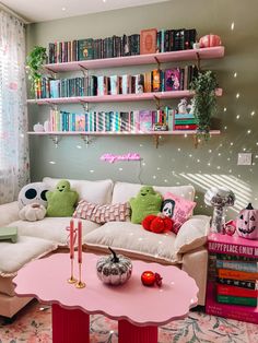 a living room filled with lots of furniture and bookshelves on top of shelves