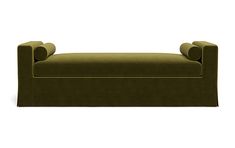 an upholstered green couch with rounded arms and back rests against a white background