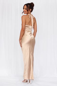 Length from neck to hem of size S: 142cm. 
 Chest: 36cm, Waist: 34cm, across front only of size S. 
 Maxi dress. 
 Lined. 
 Model is a standard XS and is wearing size XS. 
 True to size. 
 Non-stretch. 
 Luxurious satin. 
 Halter tie neckline. 
 High neck. 
 Elastic back. 
 Vent extension. 
 Straight, flowy silhouette. 
 Zipper with hook eye closure.  
 Cold hand wash only. 
 Polyester. 
 This material is very delicate. Please handle with care. 
 Please Note: This product is a Exclusive.  
 
 St Candy Dress, Dress Champagne, Prom Shopping, Lilac Dress, Satin Maxi, Satin Maxi Dress, Satin Midi Dress, Sequin Mini Dress, Pink Mini Dresses