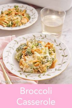 broccoli casserole on a plate next to a glass of water