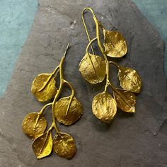 Elevate your style with these stunning gold leaf earrings, delicately crafted to add a touch of elegance to any outfit. The shimmering gold leaves dangle gracefully from your ears, catching the light with every movement. Part of a 3 Piece Set. Gold-plated Leaf-shaped Earrings, Gold Leaf-shaped Earrings For Party, Nature-inspired Gold Earrings With Ear Wire, Yellow Gold Leaf-shaped Brass Earrings, Nature-inspired Gold Earrings, Elegant Leaf-shaped Brass Earrings, Gold Leaf-shaped Earrings For Gift, Gold Leaf Earrings For Gift, Gold Leaf-shaped Earrings