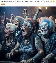 group of women with their arms in the air