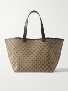 Gucci's tote is spacious, versatile and timeless, making it the perfect everyday style. Crafted in Italy from canvas-jacquard, it's woven with the house's iconic 'GG' monogram and has leather trims including a detachable zipped pouch for small essentials. Stow your laptop, water bottle and spare pair of flats inside. Bag Wishlist, Gucci Tote Bag, Flat Dress Shoes, Gg Monogram, Gucci Tote, Gucci Eyewear, Gucci Leather, Shopping Ideas, Dries Van Noten