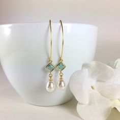 "Pearl Earrings, Gold Pearl Earrings, Pearl Dangle Earrings, Pearl Drop Earrings, Aquamarine Earrings, Aqua Pearl Earrings, Wedding Bridal Earrings, Bridesmaid Gift, Pearl Jewelry Stunning combination, these earrings are composed of a gold plated faceted aqua glass connector with a 14x8mm faux teardrop pearl dangling beneath and simply hung from long gold tone copper ear wires. Can be made in a short version if desired. Dangle length is 2-1/4\" (58mm) from the top of ear wire. Discount for multi Dangle Earrings For Bridesmaid Gift, French Hook Pearl Drop Earrings For Wedding, Drop Pearl Earrings With French Hook For Wedding, Dangle Hoop Earrings With Ear Wire For Wedding, Wedding Pearl Drop Earrings With French Hook, French Hook Dangle Jewelry For Wedding, French Hook Dangle Wedding Jewelry, Wedding Dangle Jewelry With French Hook, Earrings Gold Pearl