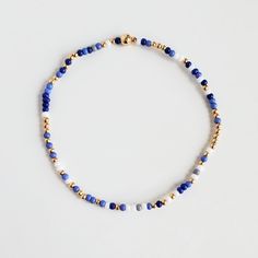 I added a pop of colour to my Classic gold bead bracelet and it is the perfect addition to a dainty stack. The beads are strung on a premium stretch cord. You will love this blue Shades MixSOLD BY ONE BRACELET or Set of fourITEMS DETAILS:Water Resistant -Nickel-free - Allergy-free- 18K gold plated brass beads made to last- round bead size: 2mm- Glass seed beads 2mm- stretchy elastic cord, no clasp, designed to fit wrist sizes from 6 - 7 inches 2 Mm Bead Bracelet, Green Bead Bracelet Diy, Dainty Blue Round Bead Bracelets, Dainty Blue Bracelets With Faceted Beads, Blue Tiny Beads Stretch Bracelet For Friendship, Blue Heishi Beads Bracelet With Gold Beads, Blue Heishi Beads Bracelet With Gold Accents, Adjustable Hand-strung 14k Gold Filled Stretch Bracelet, Elegant Blue Friendship Bracelets With Colorful Beads