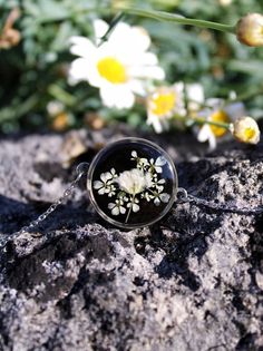 Silver stainless steel bracelet, adjustable 16 to 20cm Dried flower, baby's breath flower on black background.  🏡  Handmade with care in Dordogne, France 📃Informations  *Gift wrapping option available.  ✨Where to find us? *Instagram: www.instagram.com/paquerettepaillette/ *Facebook: www.facebook.com/Paquerette-Paillette-103227144944536/ *Mail: paquerettepaillette@gmail.com Delicate Adjustable Jewelry With Pressed Flowers, Black Flower Bracelets For Gifts, Black Flower Jewelry For Gift, Dainty Adjustable Jewelry With Pressed Flowers, Black Flower Charm Jewelry, Black Jewelry With Flower Charm As Gift, Handmade Black Flower Bracelets, Adjustable Black Flower Jewelry, Silver Birth Flower Bracelet Jewelry