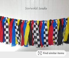 a bunch of colorful ribbons hanging from the side of a white wall with words saying find similar items