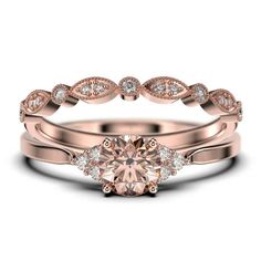 a rose cut diamond ring set on top of a wedding band