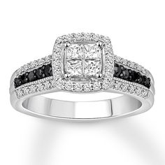 an engagement ring with black and white diamonds