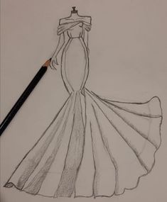 a drawing of a dress on paper with a pencil