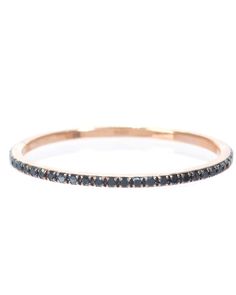 a thin gold band with black diamonds