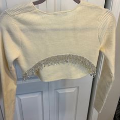 Elevate Your Wardrobe With This Stunning Beaded Crop Sweater From Zara. This Medium-Sized Sweater Is Perfect For Women Who Love To Keep Up With Fashion Trends. It Features Intricate Beading Accents That Add A Touch Of Glam To Any Outfit. This Sweater Is Perfect For Any Occasion, And Its Versatile Design Makes It A Must-Have For Any Fashion-Forward Woman. With Its Quality Material, You Can Expect Comfort And Durability That Will Last You For Years. Get Your Hands On This Beautiful Sweater Today A Elegant Spring Top With Rhinestone Fringe, Spring Fitted Tops With Rhinestone Fringe, Fitted Tops With Rhinestone Fringe For Spring, Fitted Spring Tops With Rhinestone Fringe, Zara Fitted Tops With Rhinestones, Zara Fitted Rhinestone Tops, Zara Rhinestone Party Top, Beaded Fitted Tops For Winter, Fitted Beaded Tops For Winter