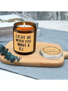 a candle sitting on top of a wooden tray