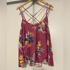 Nwot Free People Floral Tank With Criss Cross Strap And Generous Body, Size Large Casual Pink Tank Top With Floral Print, Casual Pink Floral Print Tank Top, Pink Cotton Tank Top For Vacation, Pink Floral Print Tank Top For Day Out, Pink Summer Tank Top For Vacation, Casual Purple Tank Top With Floral Print, Pink Tank Top For Beach Vacation, Purple Tank Top For Vacation, Pink Tropical Print Beach Top