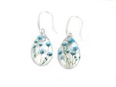 "This listing is for a resin handmade dangle drop earrings with real Baby's breath earring made of clear eco resin, that help to preserved the nature beauty for a long time. Lightweight and comfortable to wear. Earring Hooks length: 5/8\" (26 mm) Resin size: 5/8\"x 15/16\" (16 x 25 mm) Hypoallergenic stainless steel hooks Hypoallergenic - No rust, not dark, not oxidized, very strong, does not cause allergies. Chain made of natural surgical metals without impurities. Suitable for those with sensi Silver Drop Earrings With Pressed Flowers, Silver Pressed Flowers Drop Earrings, Silver Earrings With Pressed Flowers For Wedding, Resin Birth Flower Drop Earrings, Handmade Resin Teardrop Earrings As Gift, Flower-shaped Resin Jewelry Gift, Pressed Flowers Drop Earrings Jewelry Gift, Flower Shaped Resin Jewelry Gift, Resin Drop Earrings With Birth Flower Design