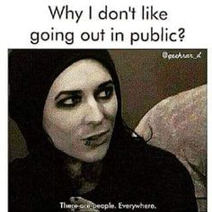 a woman with black makeup is looking at her cell phone and has the caption'why i don't like going out in public? '