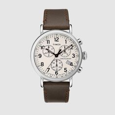 A casual way to wear a classic chronograph, the careful attention to detail allows the Timex Standard to shine as one of the most refined everyday watches. Designed with versatility in mind, this chronograph brings together classic elements with modern materials and easily interchangeable straps. The chronograph dial and brown leather strap complement the silver-tone case and traditional oversized crown, a nod to the original wrist watch. Classic Watches With Subdials For Work, Timeless Watch Accessories With Subdials For Everyday Use, Leather Watch Accessories With Subdials For Everyday, Classic Brown Chronograph Watch With Analog Display, Classic Everyday Chronograph Watch With Subdials, Classic Chronograph Watch With Subdials For Everyday Use, Classic Chronograph Watch For Work, Casual Chronograph Watch With Subdials, Classic Chronograph Watch With Tachymeter For Business