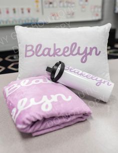 personalized pillow and shampoo on a bed