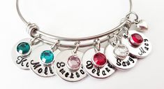 "Personalized Mother's Day Gift for Mom, Nana Grandma Bracelet with grandkids names, Birthstone Bracelet for Mother, Birthday gift for Mom Adjustable bangle bracelet comes with a hand stamped name charm with birthstone crystal. (You may choose to add more name charms and birthstones from the drop down menu) a tiny silver heart charm. Bracelet bangle is made of stainless steel. Please leave us a message in the \"personalization box\" to let us know the names and birthstones you would like. Each b Grandma Jewelry, Mother Bracelet, Mom Jewelry Personalized, Grandma Bracelet, Sterling Silver Locket Necklace, Mom Necklace Personalized, Compass Jewelry, Mom Bracelet, Mothers Bracelet